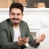 happy-smiling-handsome-man-sitting-chair